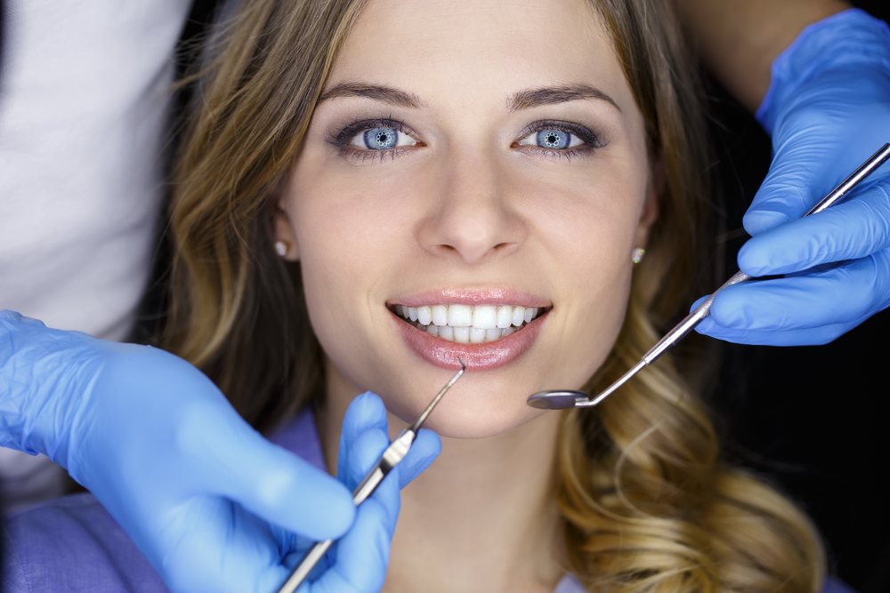 What causes teeth to turn black and how to whiten them?