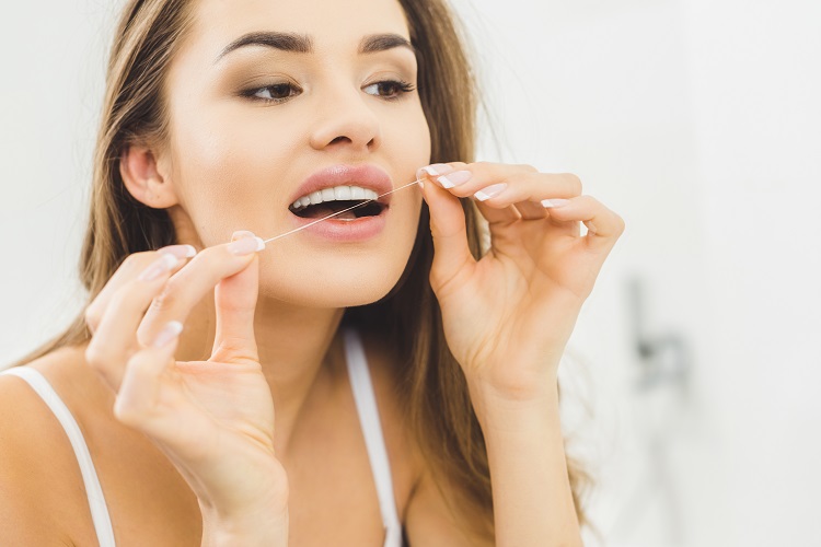 flossing before brushing teeth